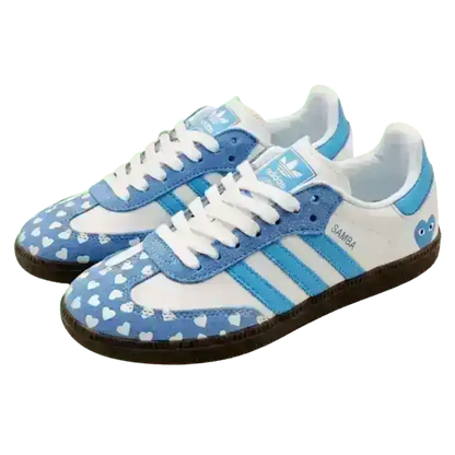 Adorable Adidas Samba love heart edition shoes with a blue and white color scheme, making a charming statement for any occasion.